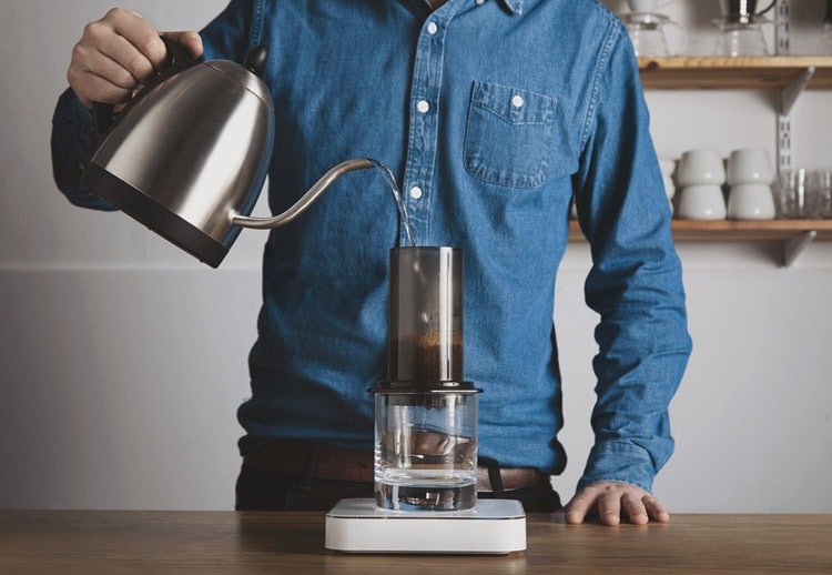 pour-water-into-Keurig-Coffee-Machine