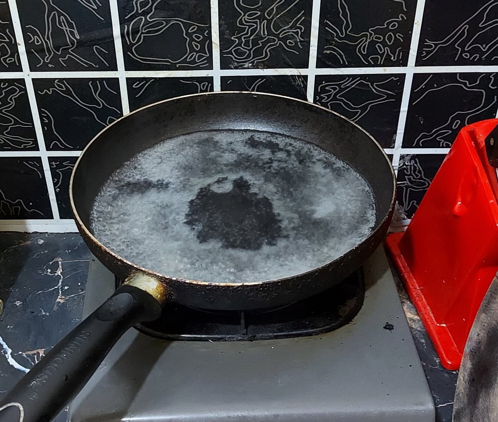 Treat the warped pans with boiling water