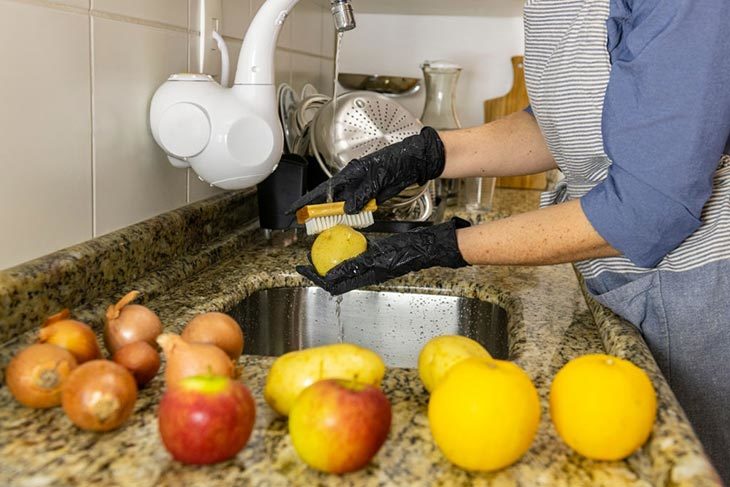 Use a scrubbing brush/ exfoliating bath gloves to take off the dirt and the pesticides