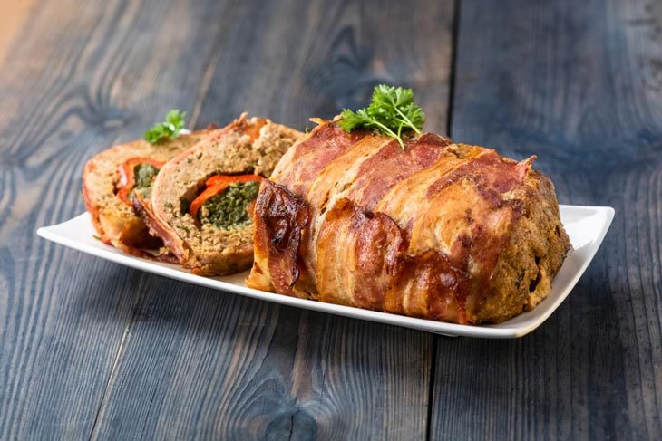 How long to cook stuffed pork roast per pound?